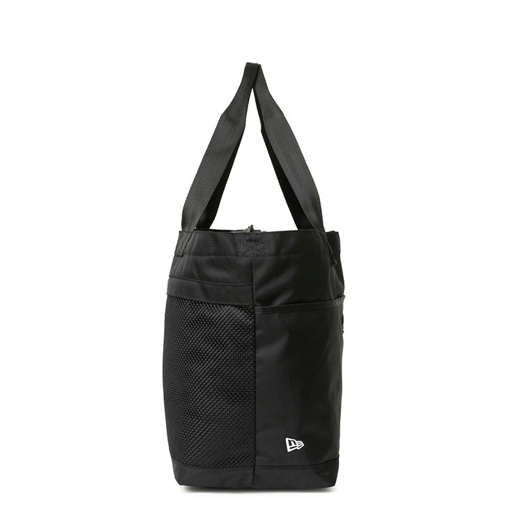 New Era basic black gym tote bag featuring a mesh side pocket, fabric top handles, and a small flag logo at the bottom corner.