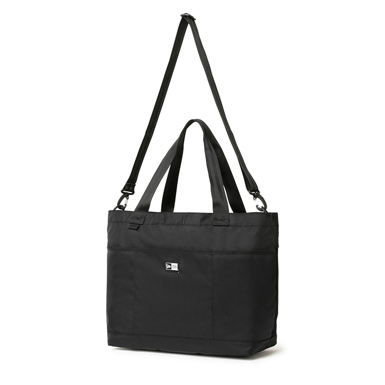 New Era basic black gym tote bag with  with dual top handles, an adjustable shoulder strap, and a small box logo on the front.