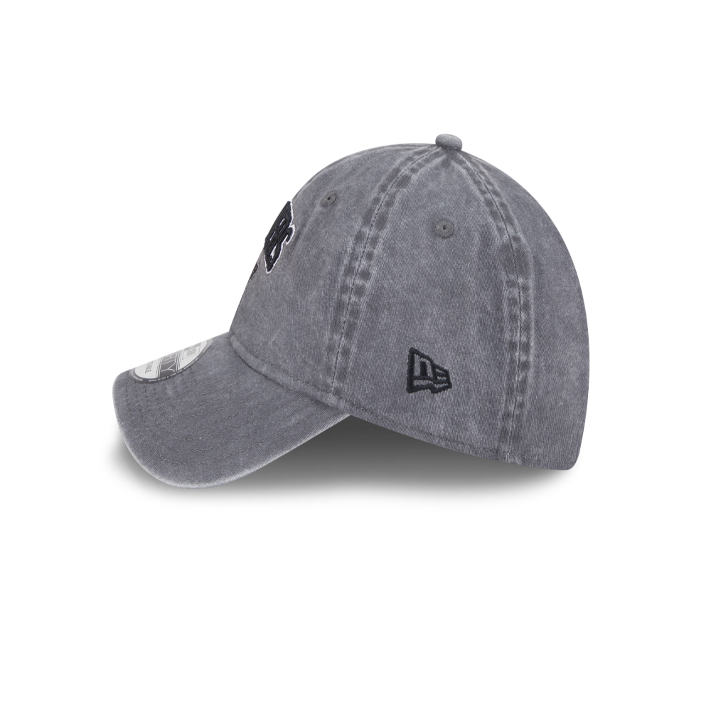 A gray washed baseball cap with a black embroidered New Era logo on the side, shown on a clean white background.
