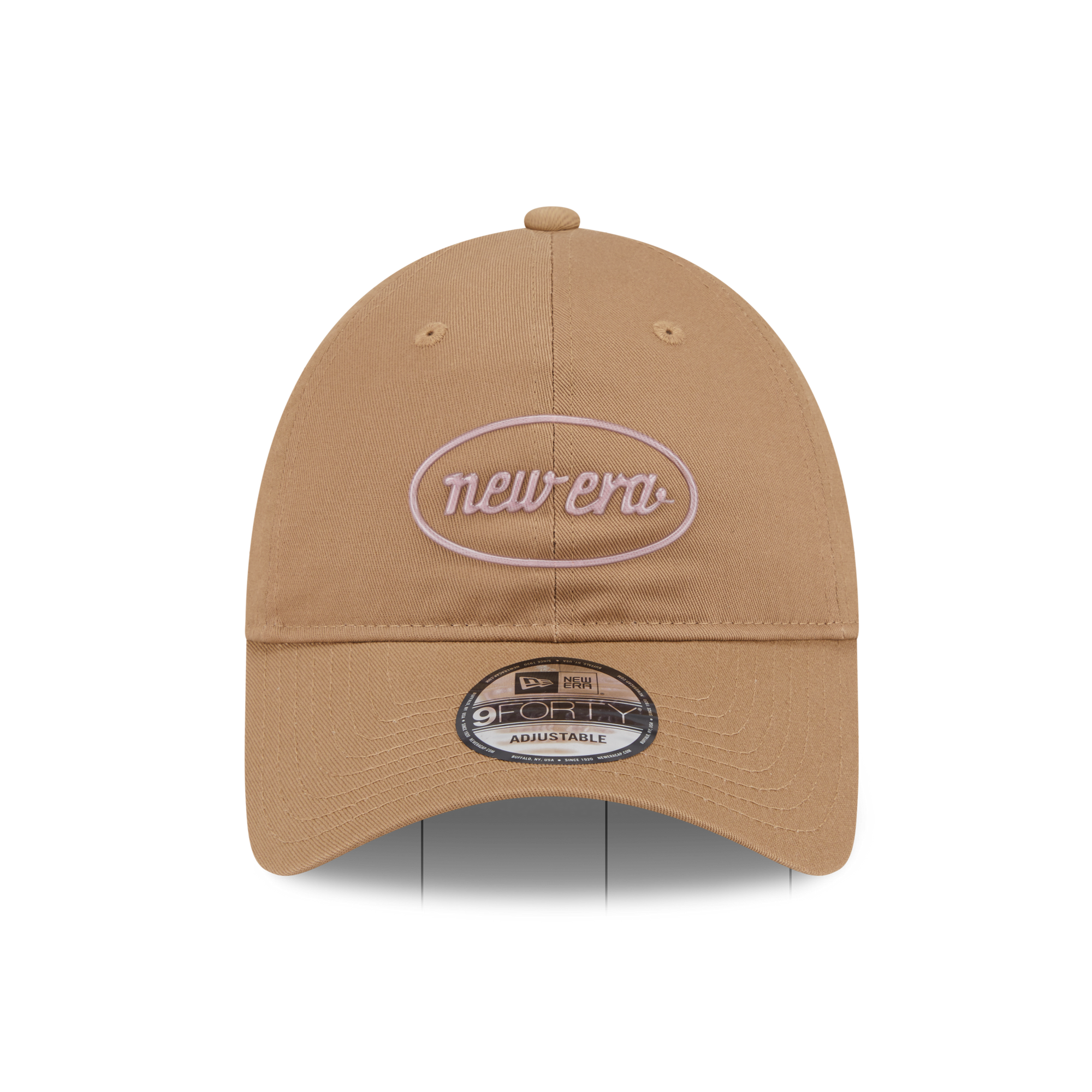 A tan New Era baseball cap with a light pink embroidered oval logo on the front and a black and white 9FIFTY sticker on the brim, shown against a plain white background.