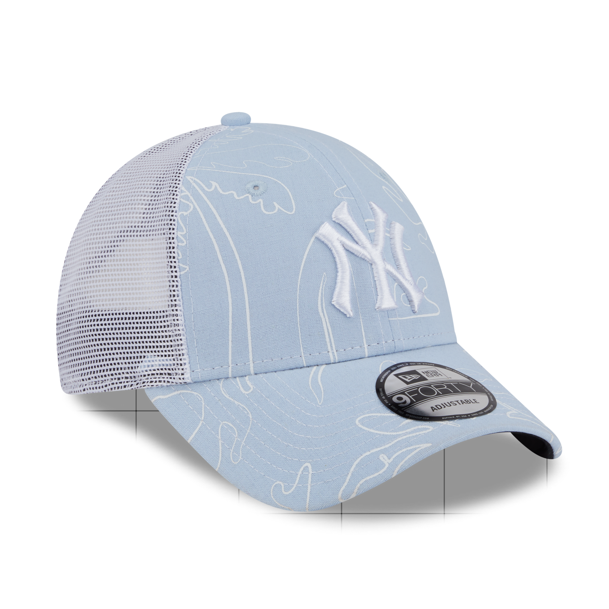A light blue New York Yankees trucker hat with white embroidered details, featuring a white mesh back and a New Era 9FORTY adjustable cap tag on the brim.