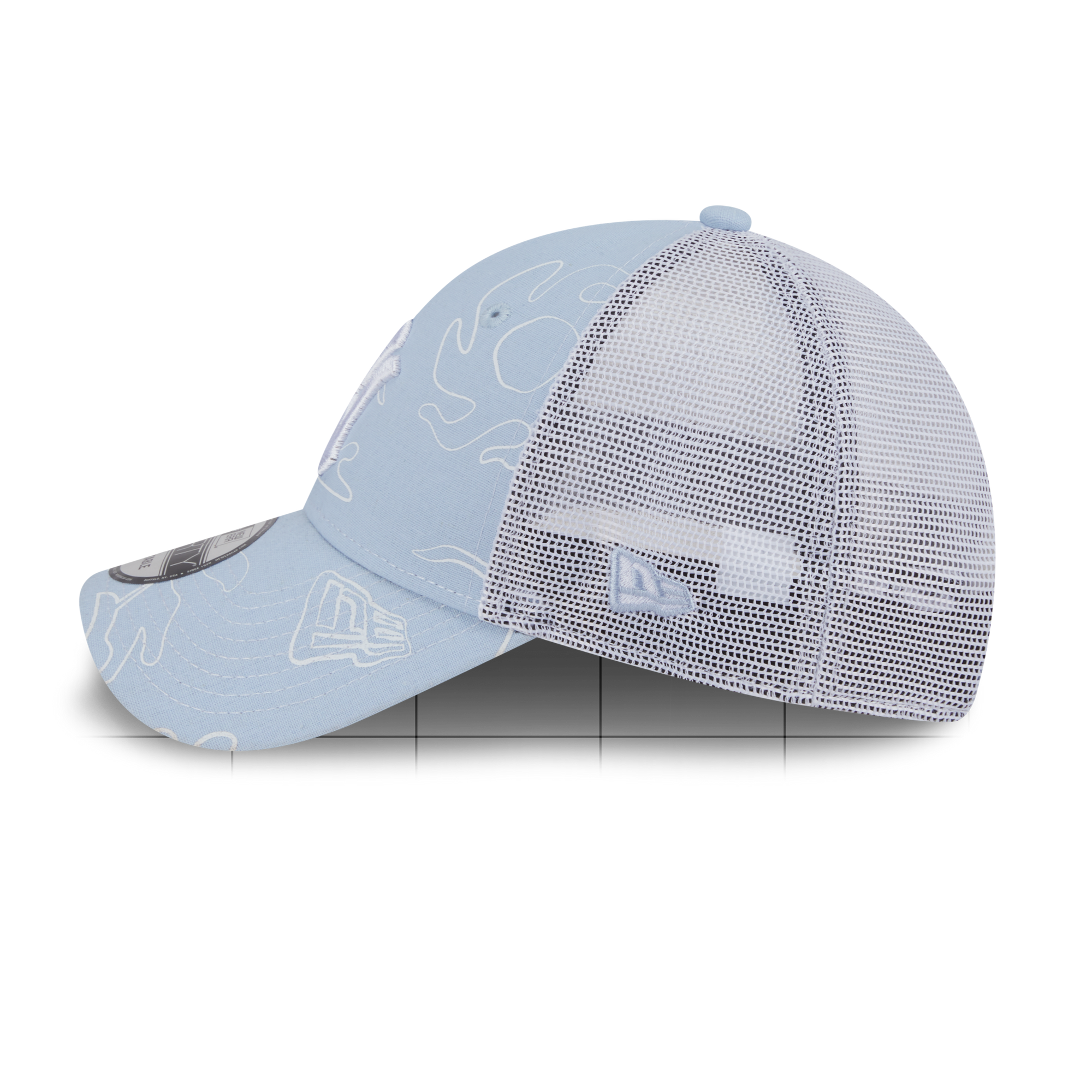 A light blue trucker-style baseball cap with a white mesh back and subtle white line-art graphics, shown on a clean white background.