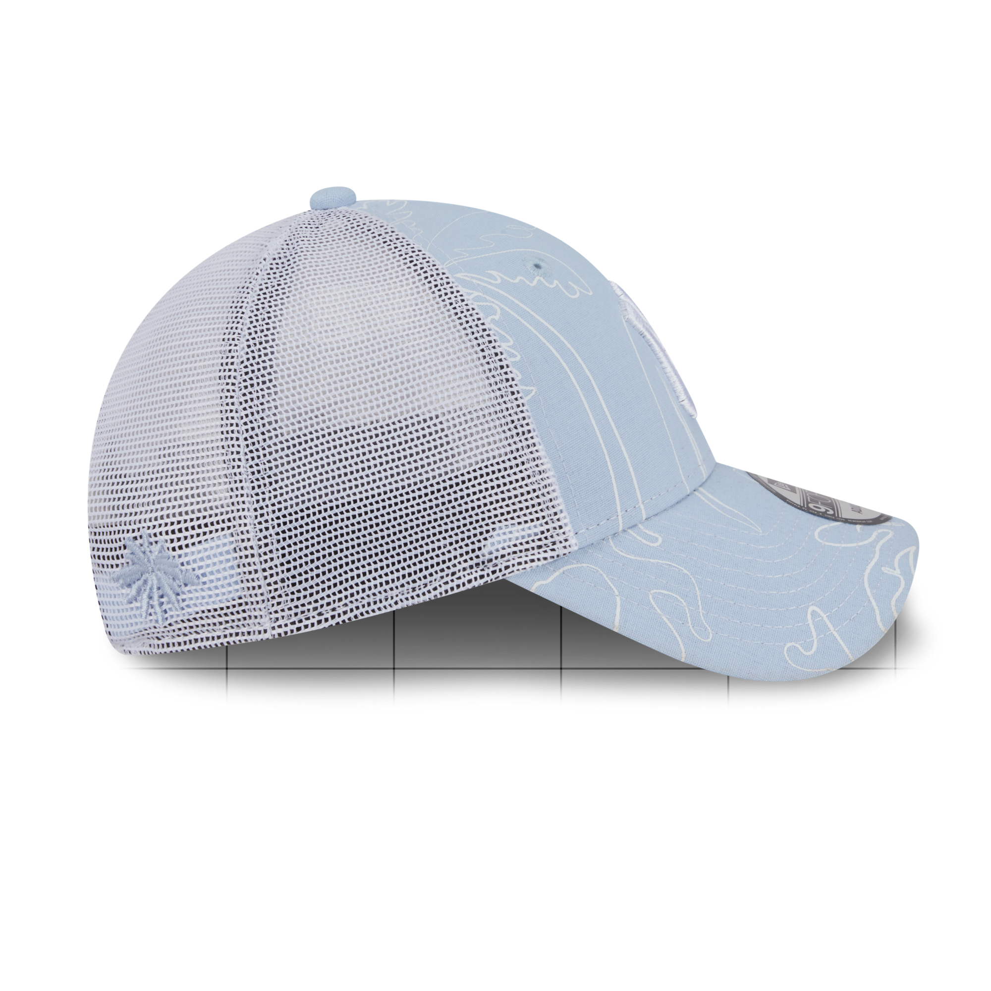 A light blue trucker-style baseball cap with a white top button, white mesh back panels, and subtle white contour line graphics on the brim and side, shown against a plain white background.