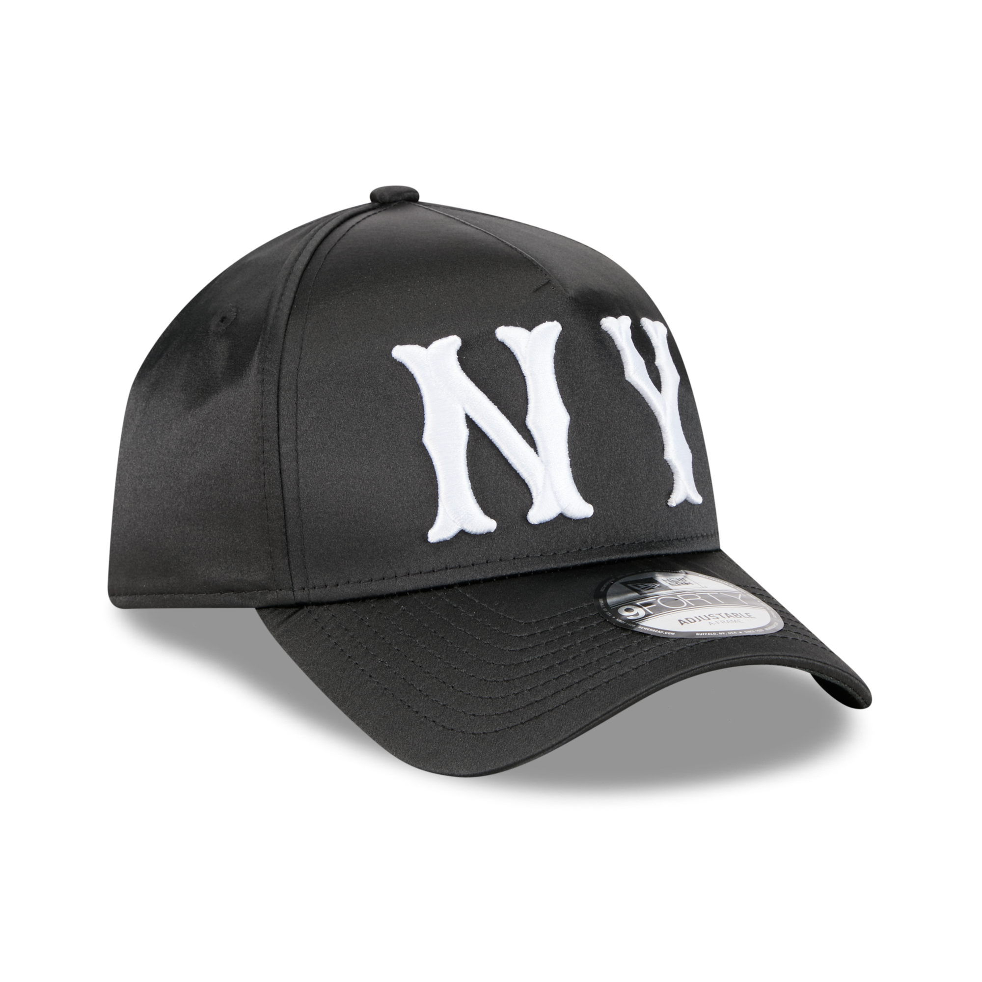 A black baseball cap with large white embroidered 'NY' lettering on the front, shown on a clean white background with a soft shadow.
