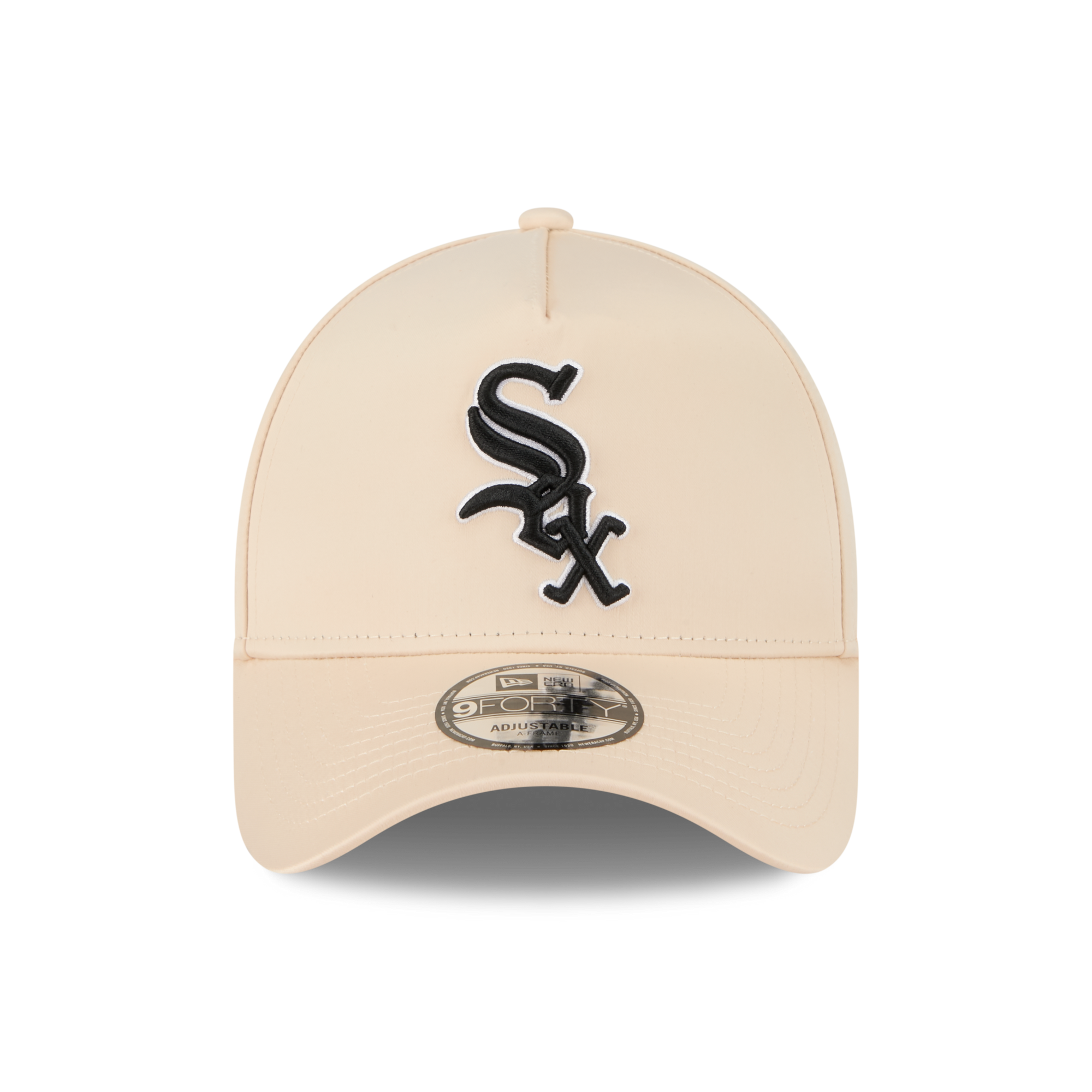 A beige baseball cap featuring a black embroidered Chicago White Sox logo on the front and a silver metal visor sticker.