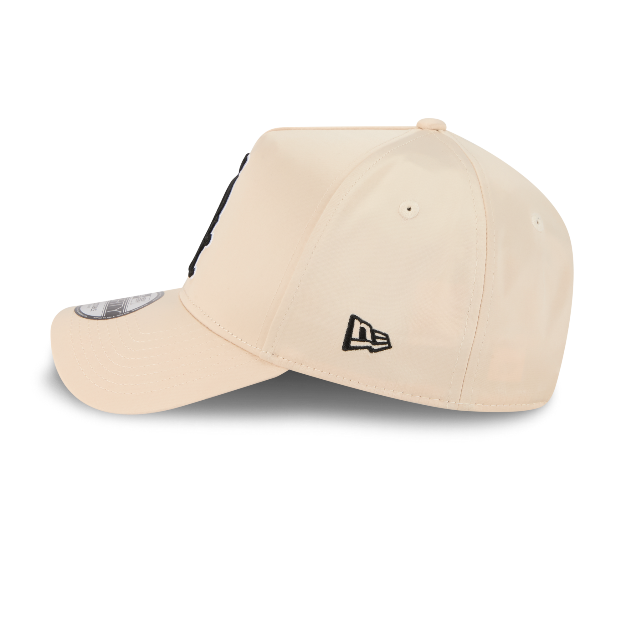 A beige New Era 9FORTY baseball cap shown from a three-quarters angle on a white background, featuring a black embroidered New Era logo on the side and a black graphic on the back panel.