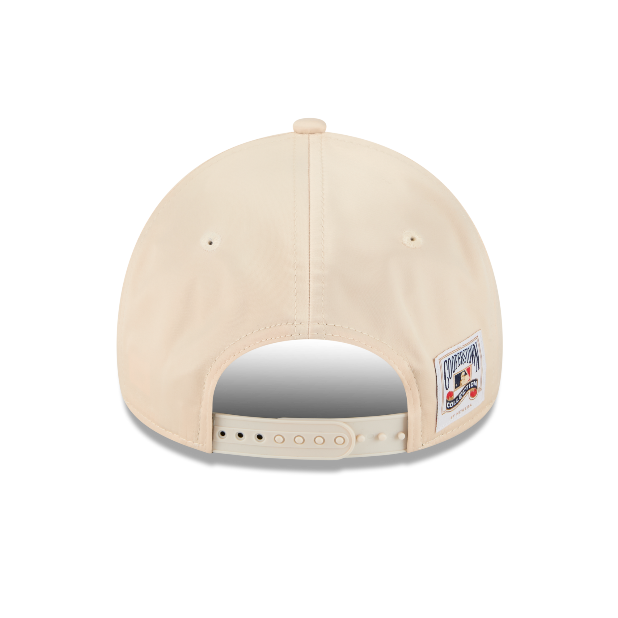 Back view of a beige baseball cap with an adjustable snapback closure and a small embroidered patch on the side, shown on a white background.