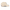 A beige baseball cap shown from a three-quarters angle on a white background, featuring a side patch with a cartoon character and a silver New Era 9FIFTY sticker on the brim.