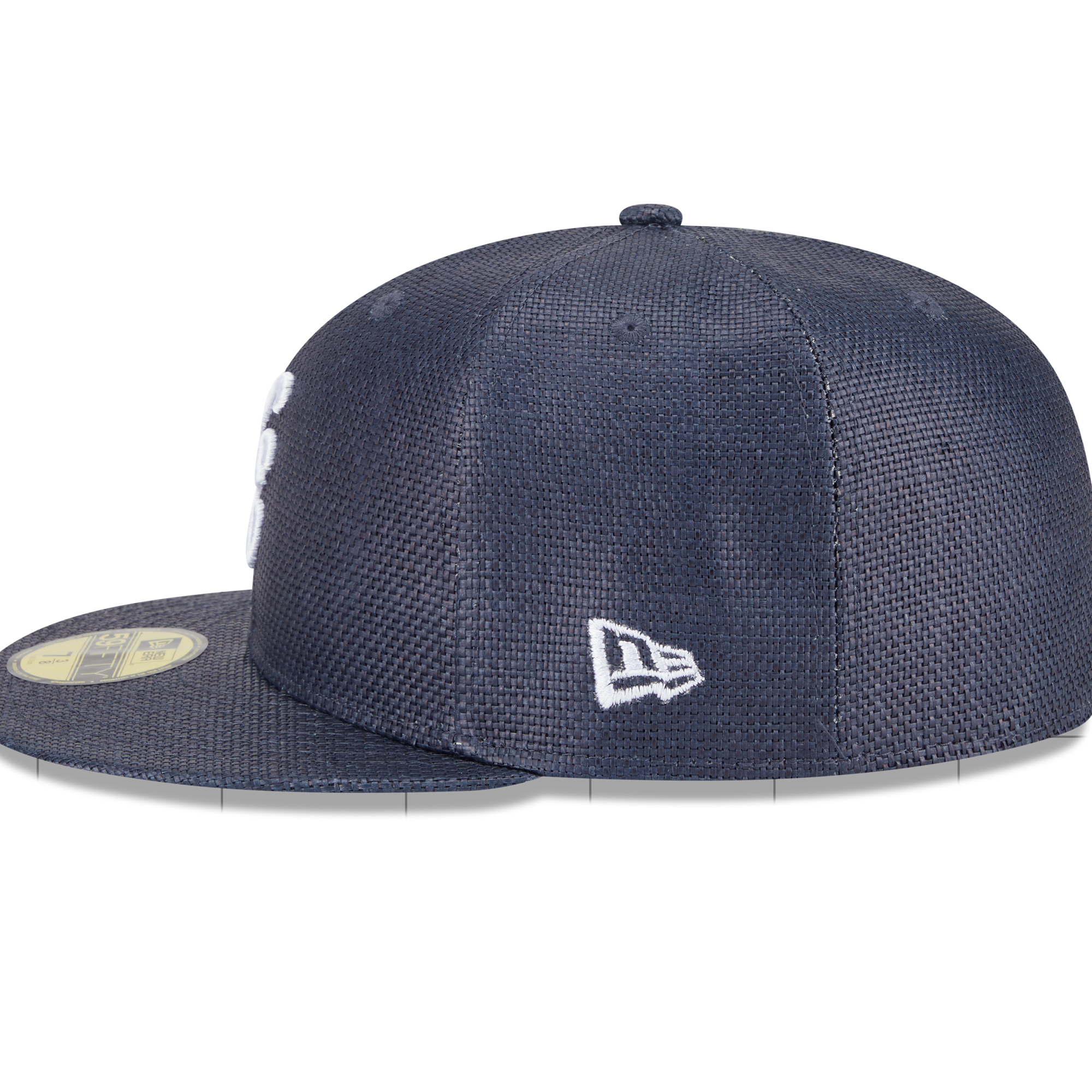 A navy blue New Era 59FIFTY fitted cap with a textured mesh pattern, featuring a white embroidered New Era flag logo on the side and a gold sticker on the brim.