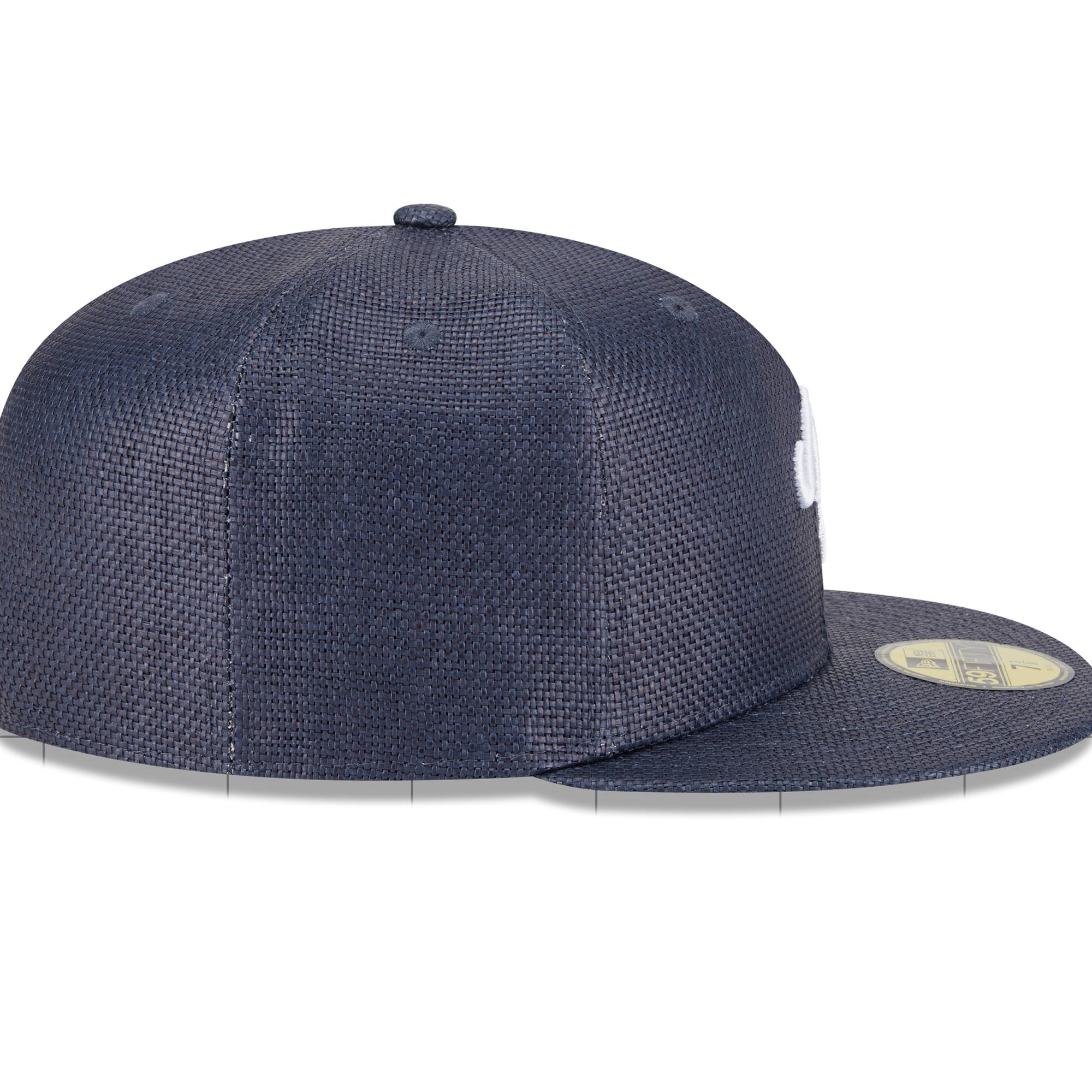 A navy blue New Era 59FIFTY fitted cap with a textured mesh pattern, featuring a white embroidered logo on the side and a gold sticker on the brim, shown against a plain white background.