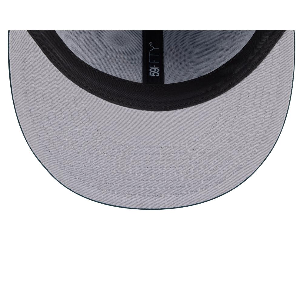 Close-up of the underside of a baseball cap showing a light gray brim, black trim, and a black interior band with the vertical brand name 'BEFTY 35' printed in white.