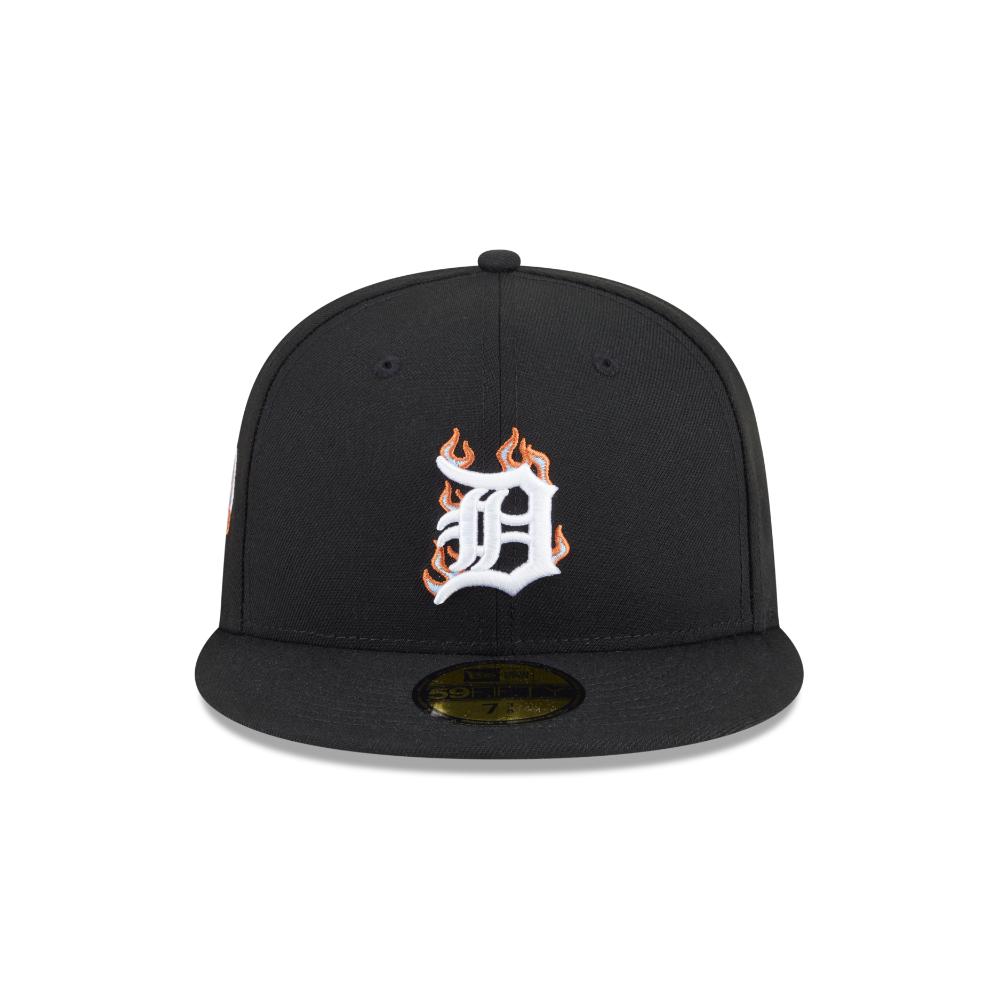 A black fitted baseball cap featuring a white stylized letter 'D' embroidered on the front with orange and yellow flame details, shown against a plain white background.