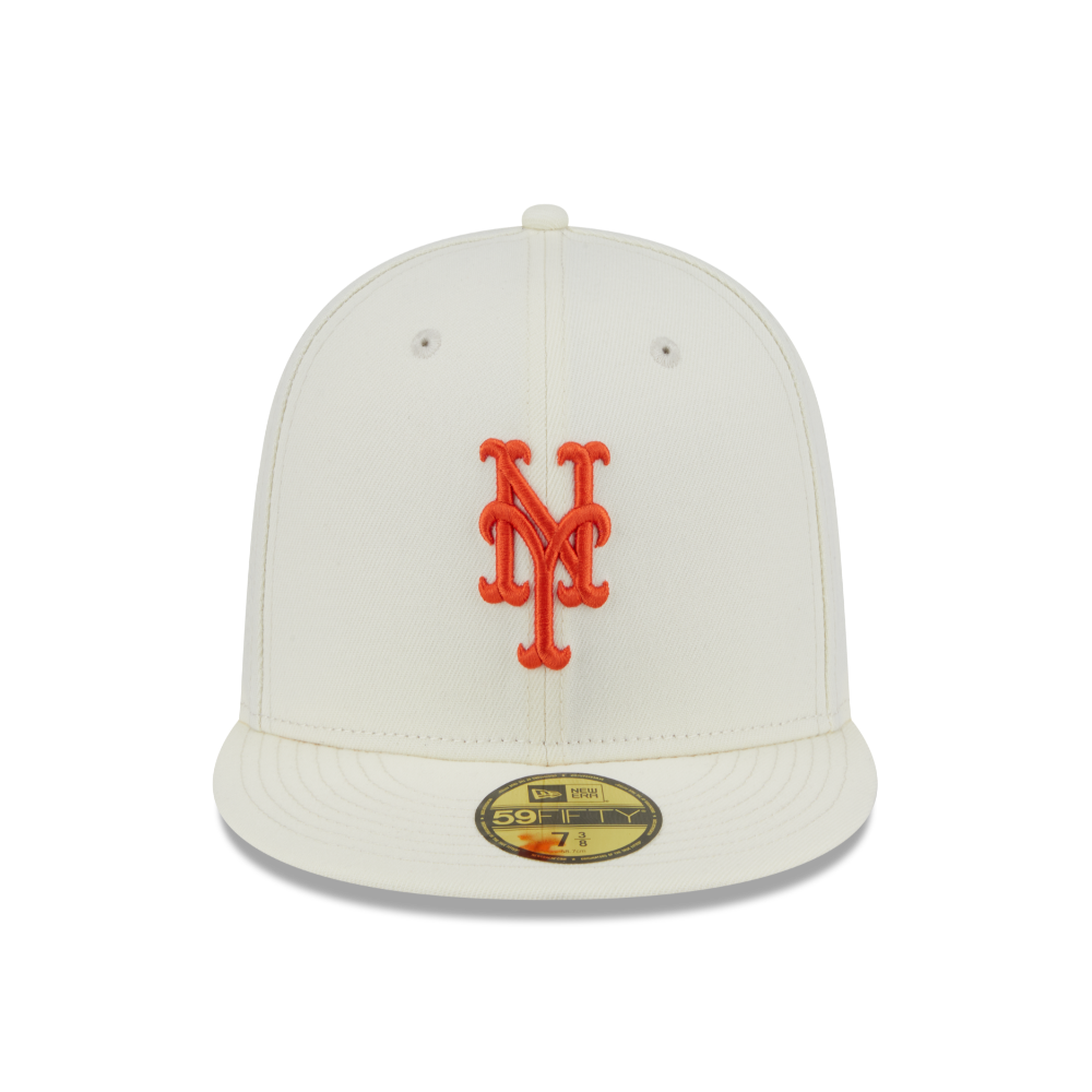 An off-white New York Mets fitted cap featuring a red embroidered 'NY' logo on the front and a gold 59FIFTY sticker on the visor, set against a plain white background.