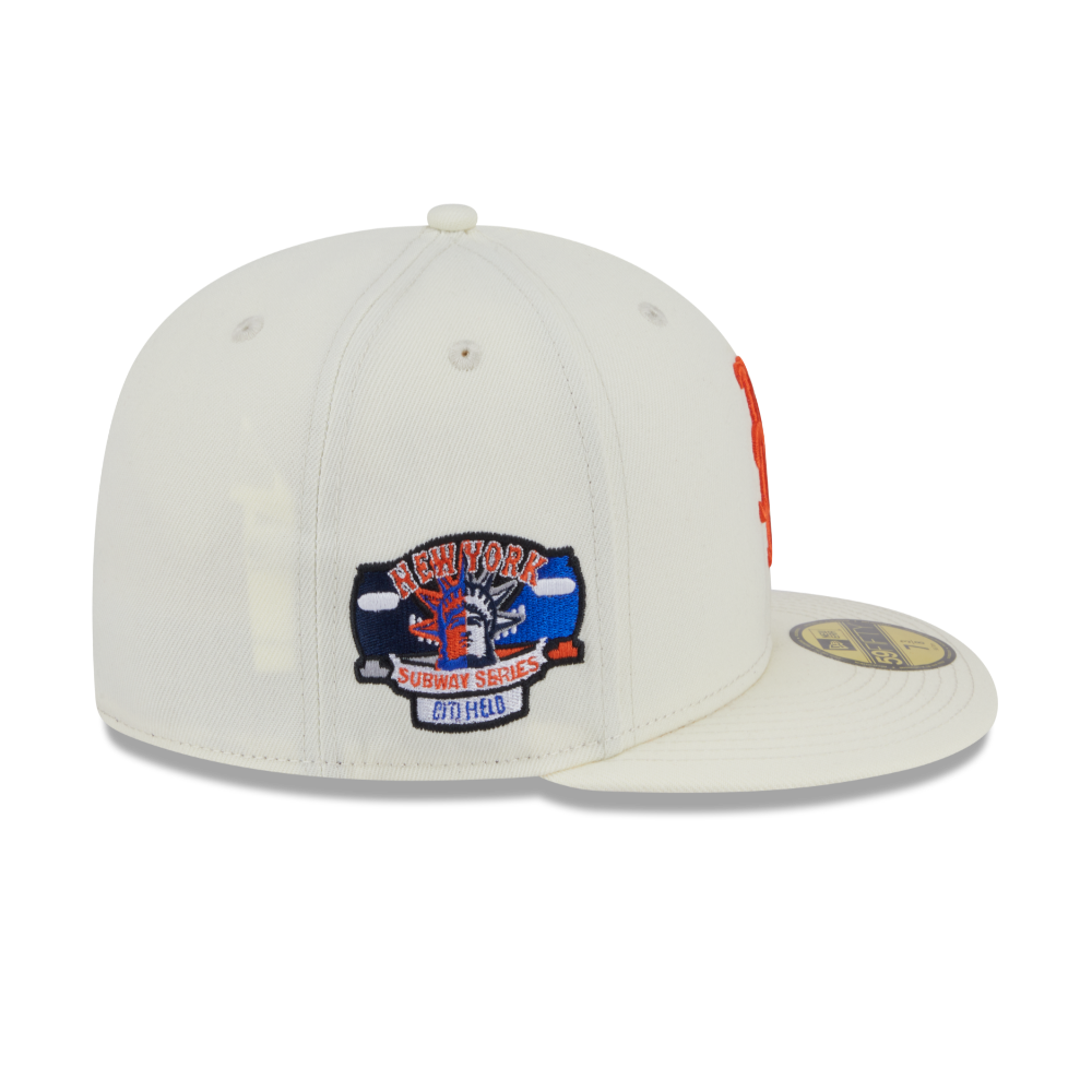 An off-white New Era fitted baseball cap featuring a New York Knicks 1994-2024 patch on the front and a gold sticker on the brim, set against a plain white background.