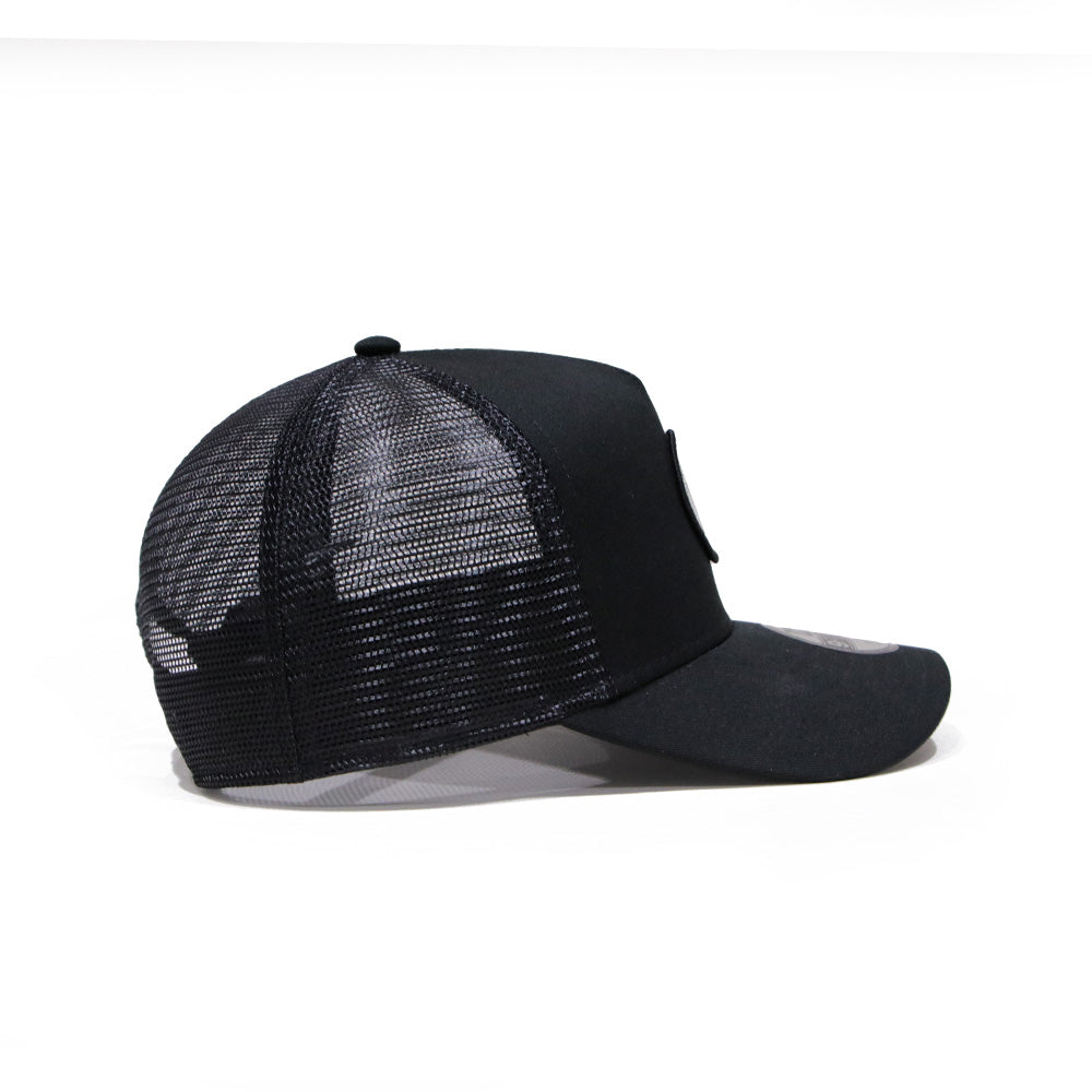 new era round patch black youth 9forty a frame trucker cap angle