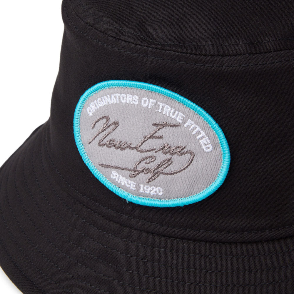 new era script oval patch black golf bucket hat close up front logo