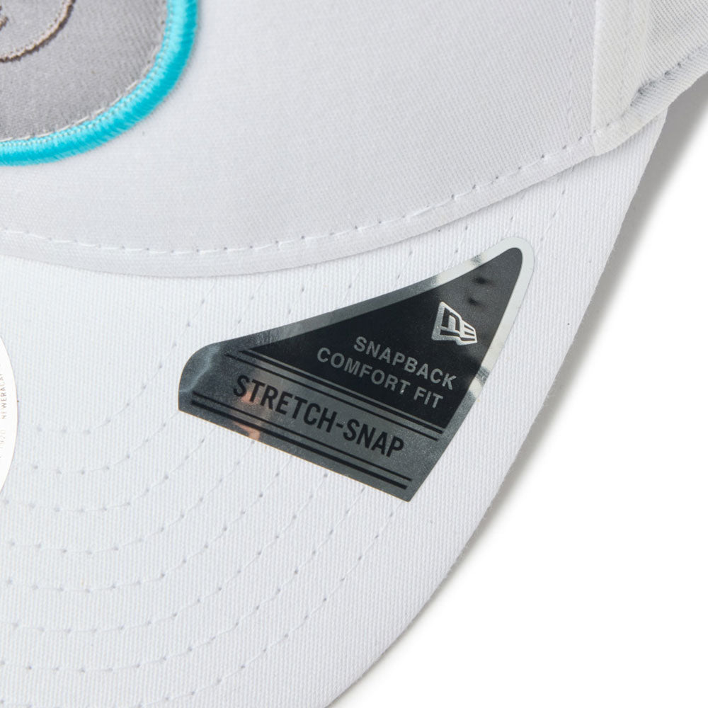 new era script oval patch white golf 9seventy stretch snapback cap logo and print