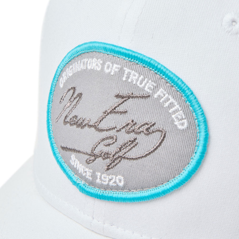 Close-up of new era script oval patch white golf 9fifty stretch snapback cap