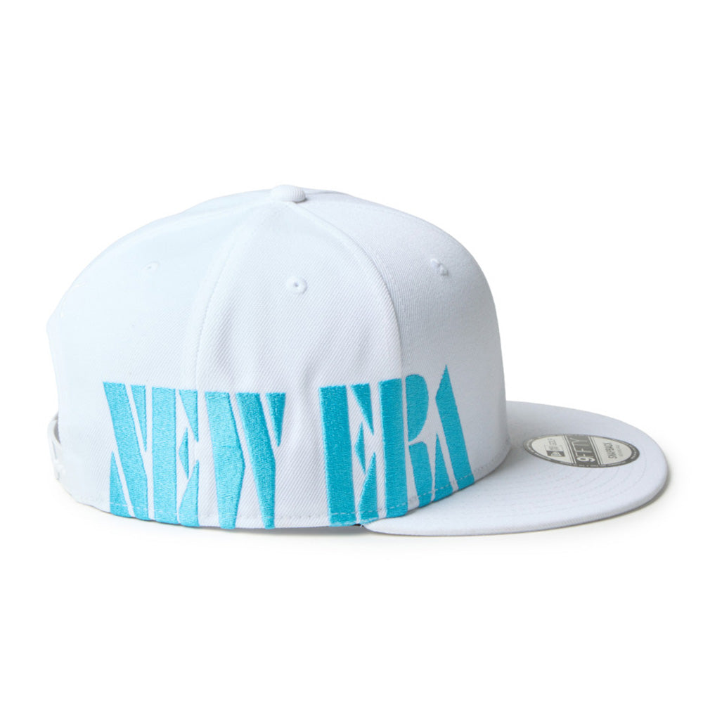 new era wordmark golf stencil logo white 9fifty snapback cap with blue text on a white background