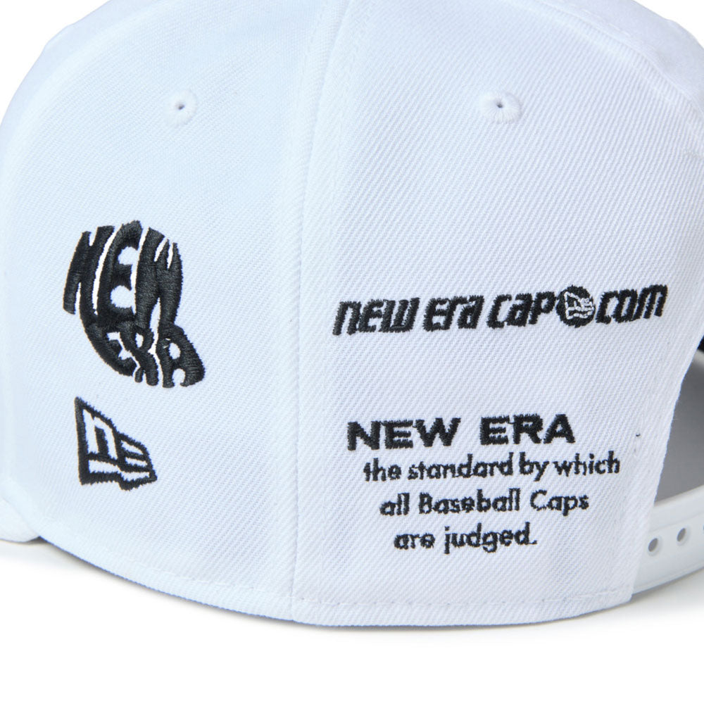 A white new era wordmark golf ne archive white 9fifty snapback cap with black printed graphics and text