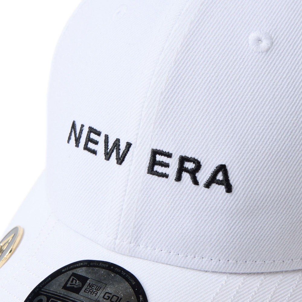 new era wordmark golf white 9forty velcro strap adjustable cap close-up front brim view with magnetic field sticker label