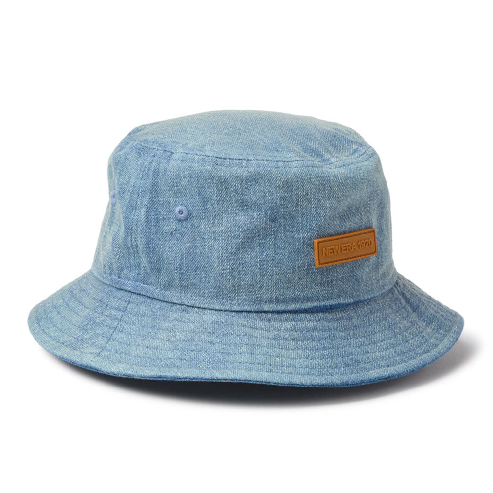 new era 1920 patch washed denim bucket hat close up front logo