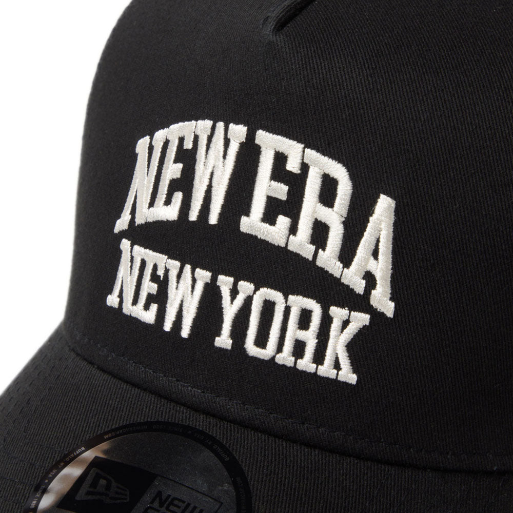 new era wordmark ne collog black 9forty a frame trucker cap with close-up view of 'New Era New York' embroidery