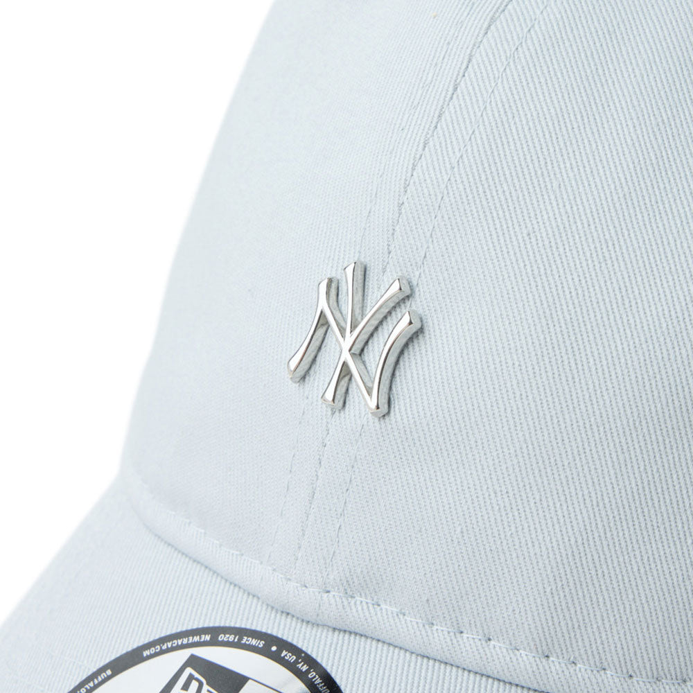 Close-up of a light graynew era script mini metal logo grey 9twenty adjustable cap with a silver logo
