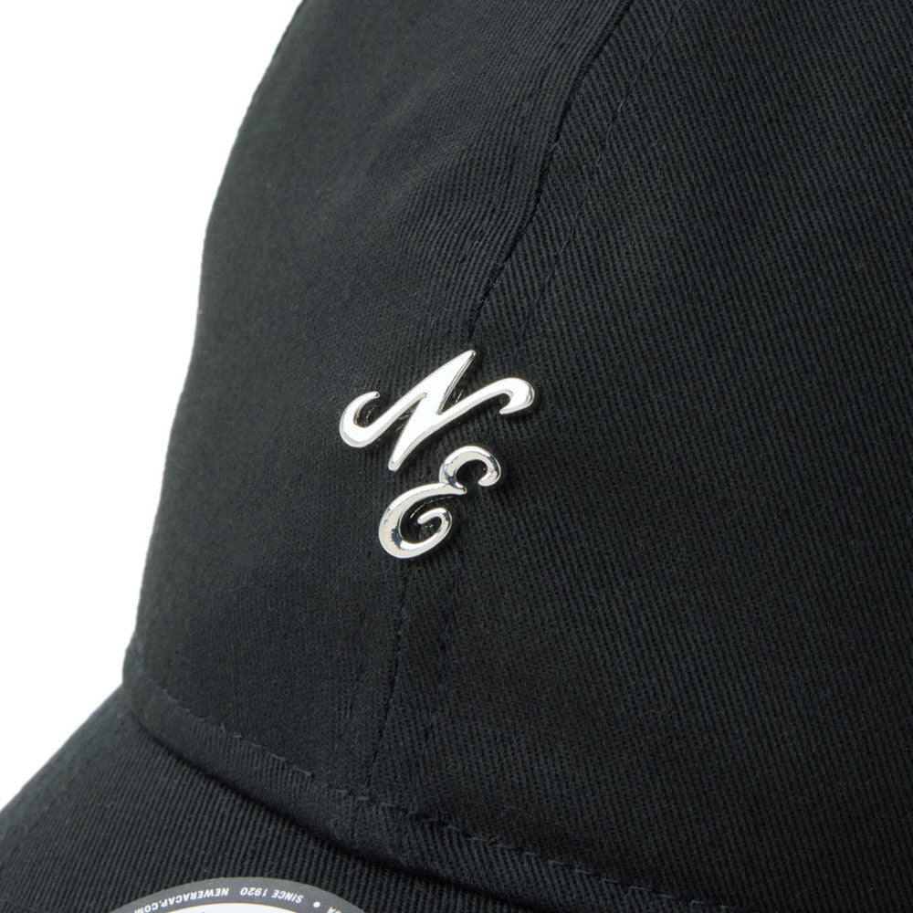 new era script mini metal logo black 9twenty adjustable cap close-up view showing synthetic metal NE Logo