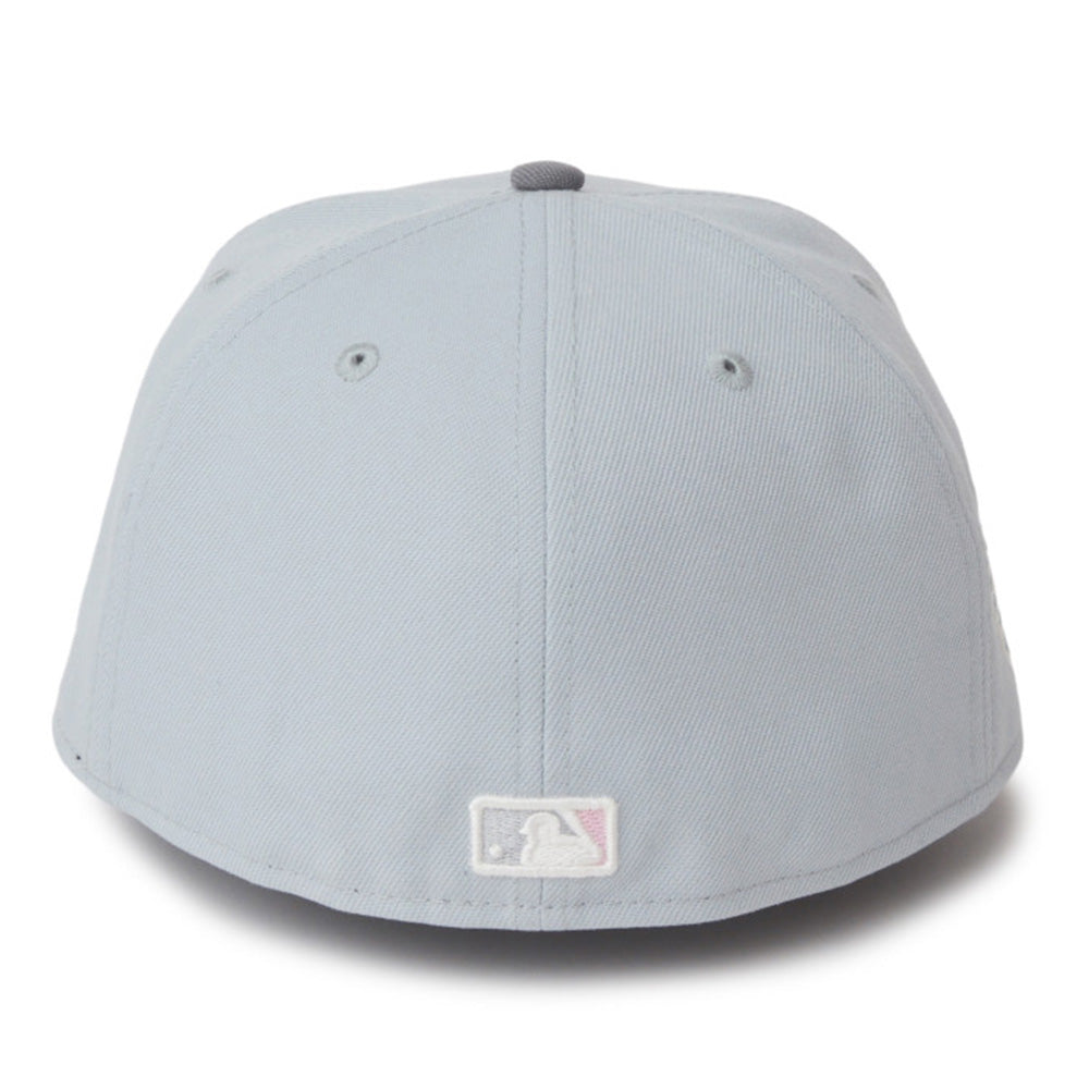 A light gray baseball cap shown from the front on a white background, featuring a small MLB logo patch on the lower front panel.