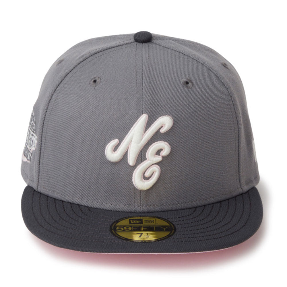 A gray and black New Era 59FIFTY fitted cap featuring a white embroidered 'NC' logo on the front, set against a plain white background.