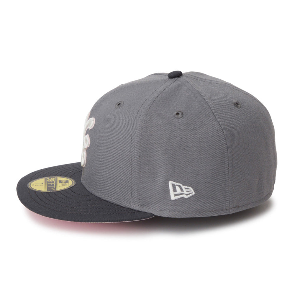 A gray and black New Era 59FIFTY fitted baseball cap with a white embroidered logo on the side, shown on a clean white background.