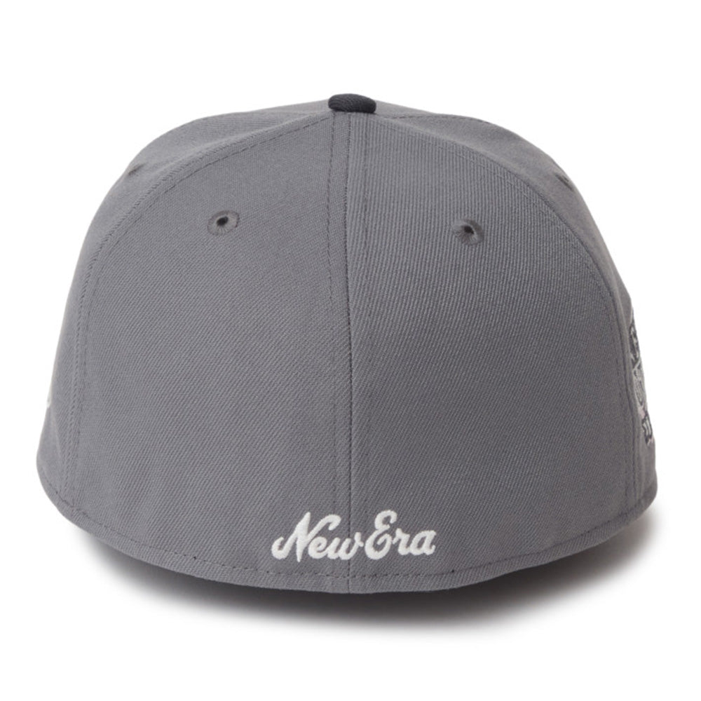 A dark gray New Era baseball cap shown from the front, featuring white embroidered 'New Era' script on the front brim and a black button on top, set against a plain white background.