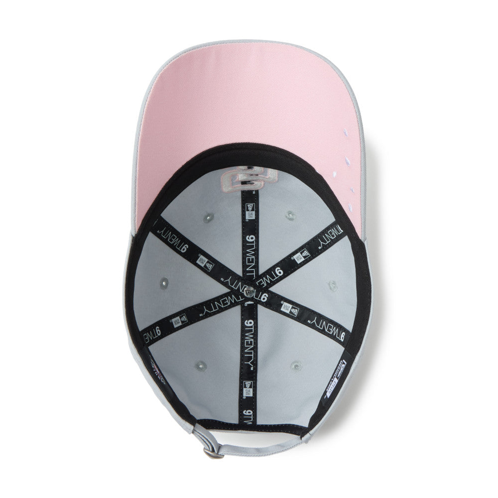 Pink and gray cap with brand logo on a white background