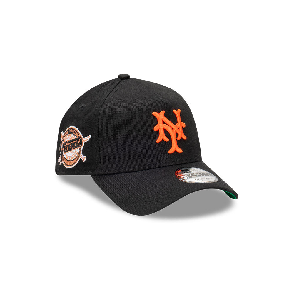 Black baseball cap with orange logo on a white background