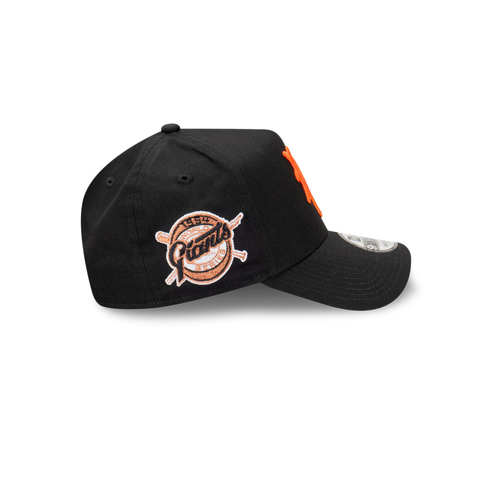 Black cap with orange and white logo on a white background